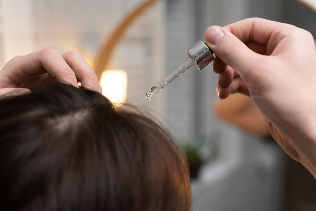applying coconut hair oil